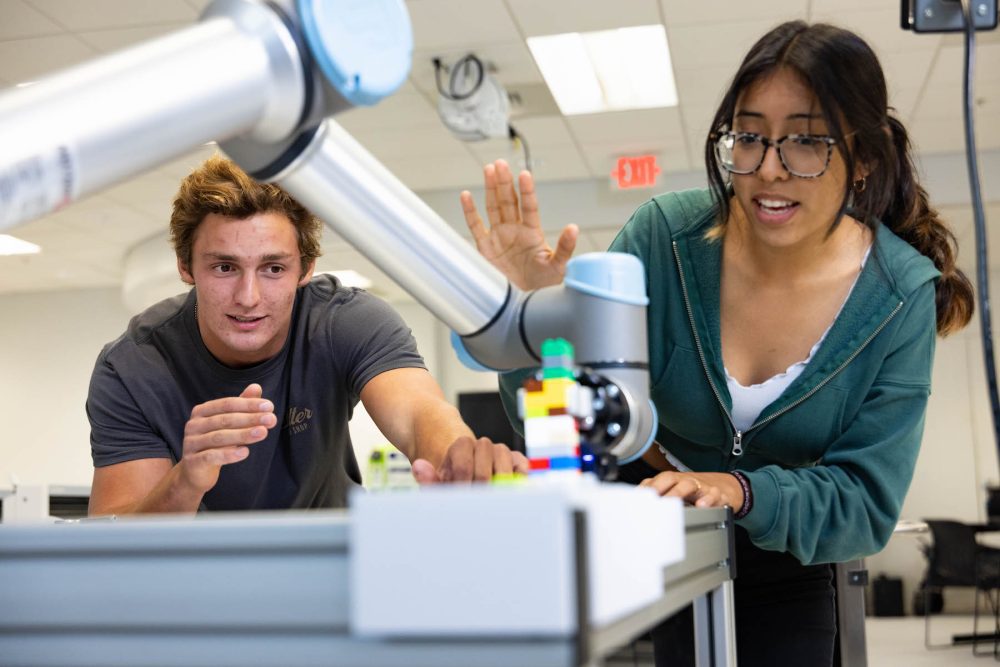 Students working in machine in Super Fab Lab