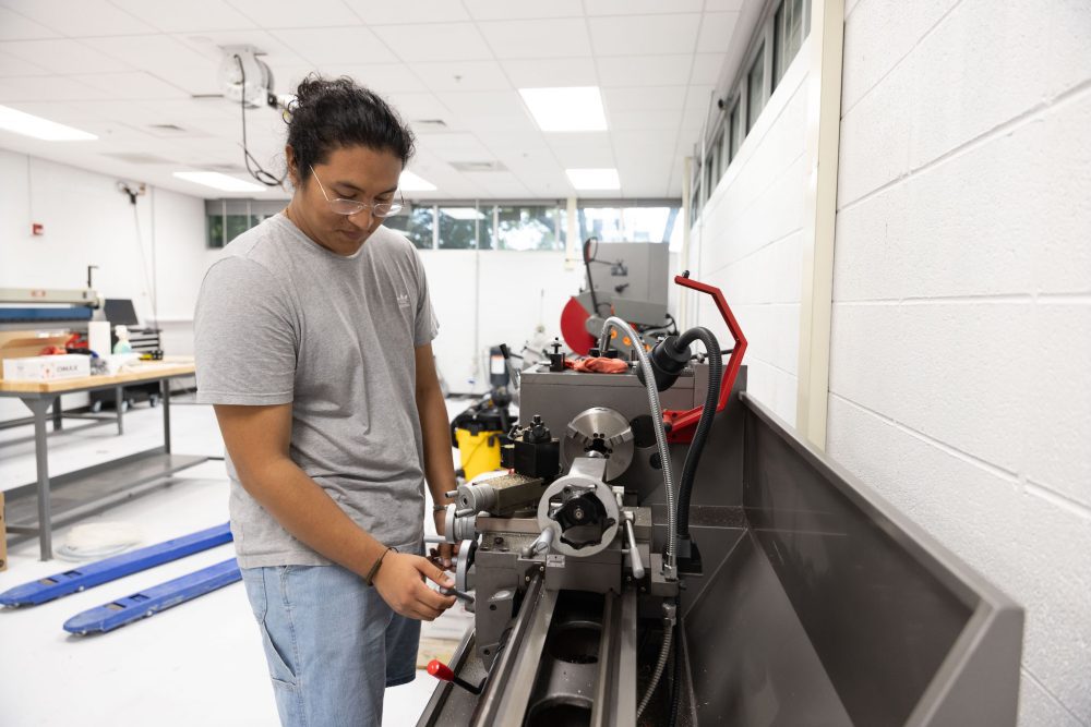 Student working at machine in Super Fab Lab